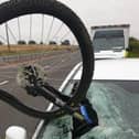 The bike embedded in the car