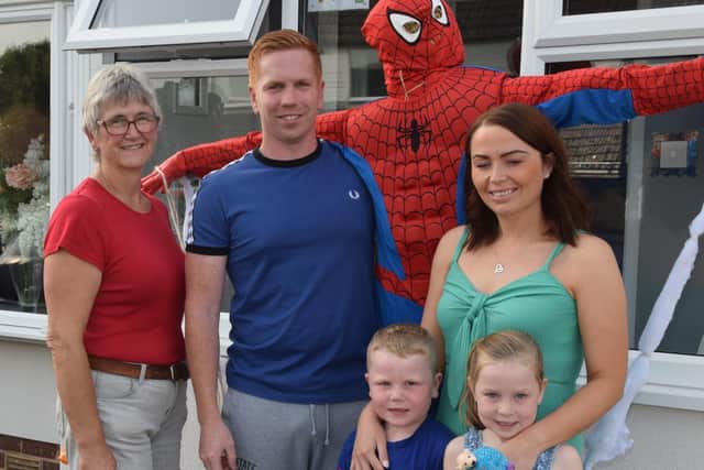 The Limon family and their winning Spiderman scarecrow