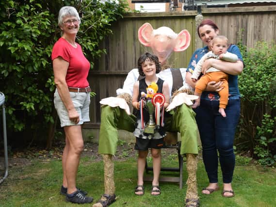 Coun Trish Crain (left) with the West family and their winning BFG scarecrow