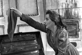 Dame Edith Evans searches through an old tin trunk in a scene from ‘Crime and Punishment’ at the New Theatre, 1946. Pic: Getty Images