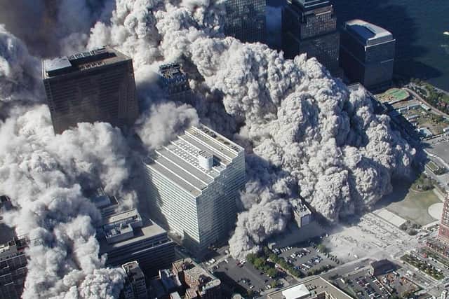 Smoke and ash engulf the general area of the World Trade Center in New York after terrorists flew two airliners into the towers. Photo: NYPD, Via ABC News, Det. Greg Semendinger
