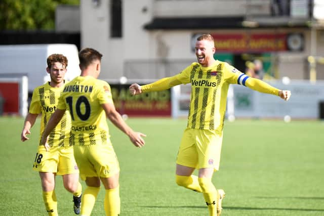 Alex Whitmore celebrates finding the net with AFC Fylde team-mate Nick Haughton Picture: Steve McLellan