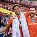 Ollie Turton celebrates promotion with Jordan Gabriel before leaving Blackpool four days later