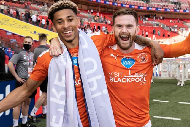 Ollie Turton celebrates promotion with Jordan Gabriel before leaving Blackpool four days later