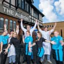 Millie Smith, Dawn Debelle Whitty, Nat Smith, Chelsea McKenzie, general manager Jake Clarke, Vicky Olver, Sam Loughnan and Sam McKenzie celebrate the reopening of the Albion pub after its £300,000 renovation.