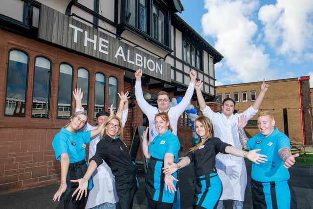 Millie Smith, Dawn Debelle Whitty, Nat Smith, Chelsea McKenzie, general manager Jake Clarke, Vicky Olver, Sam Loughnan and Sam McKenzie celebrate the reopening of the Albion pub after its £300,000 renovation.
