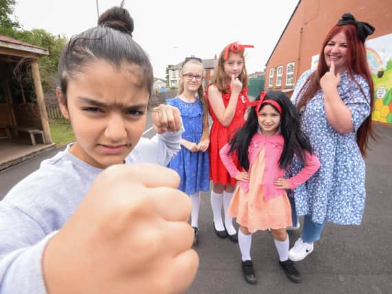 Nourhan Sheikh dressed as Miss Trunchbull with Lilly Hall, Scarlett-Louise Vale, Victoria Kalbarczyk and assistant headteacher Diane Nixon.