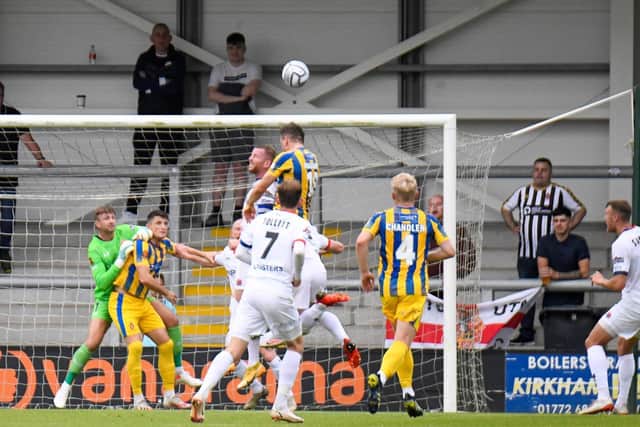 Captain Alex Whitmore clears his lines as the Fylde defence was put under pressure by Spennymoor in Saturday's FA Cup tie
Picture: STEVE MCLELLAN