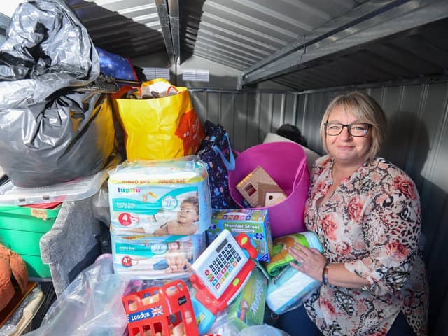 Home-Start shop manager Sue Uttley with just some of the donated items