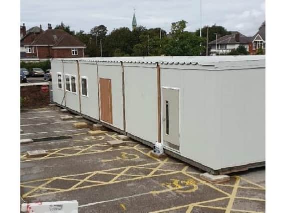 The temporary cabin which was set up on the hospital car park last year