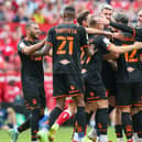 Blackpool players celebrate their winning goal at the Riverside