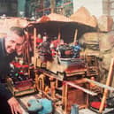 Richard Dixon with one if the sets he has built to complement his photography and, inset, with one of the models he created for Infinite Worlds movie