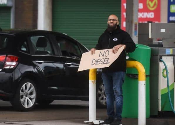 A worker at BP in Fleetwood Road North, Thornton, holds a sign saying 'No diesel' on Friday, September 24, 2021 (Picture: Dan Martino for The Gazette)