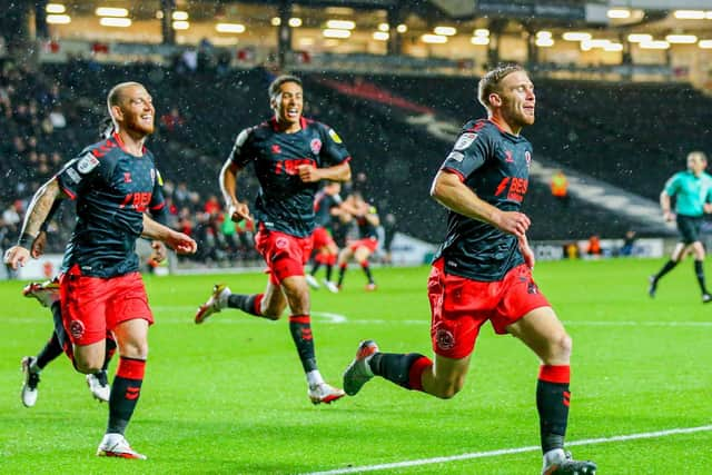 Dan Batty celebrates his late Fleetwood equaliser at MK Dons