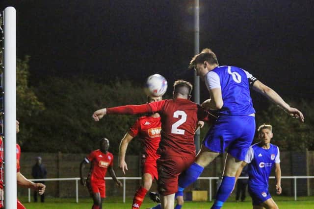 Captain Josh Westwood rises high to head home one of his two goals for Gate against Longridge Picture: IAN MOORE