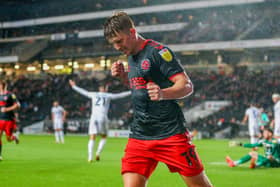 Ged Garner celebrates his second goal as Fleetwood boss Simon Grayson's planning paid off at Stadium MK