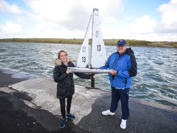 Alan Smith with his model yacht Bullet, which he named after his friend Tony Greenway. He is pictured with Tony's widow Janet Greenway.