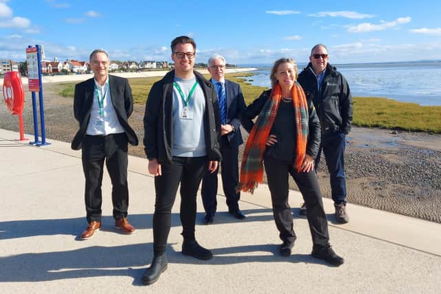Environment Minister Rebecca Pow at Fairhaven with Andy Shore, , Environment Agency senior advisor and coastal engineer; Coun Michael Sayward, chairman of Fylde Council's tourism and leisure committee, Mark Menzies MP and Steve Ball,  Fylde Council chief engineer.