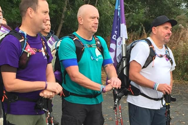 Undated handout photo issued by Papyrus of Tim Owen, Mike Palmer and Andy Airey at the start of a charity walk in memory of their three young daughters who each took their own lives (Picture: Papyrus/PA Media)