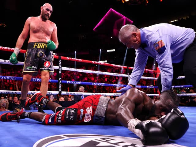 Tyson Fury (top) knocks out Deontay Wilder in the 11th round (photo: Getty Images)