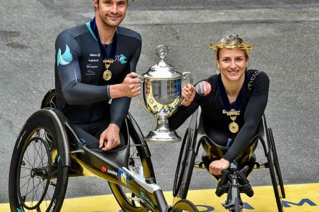 Swiss athletes Marcel Hug and Manuela Schar dominated the men's and women's wheelchair races at the Boston Marathon
