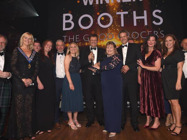 Booths team members picking up their BIBAs award