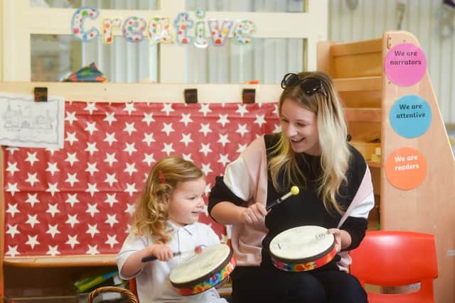 Three-year-old Aria and her mum Amanda Law play the drums together. Pic: Daniel Martino/JPI Media