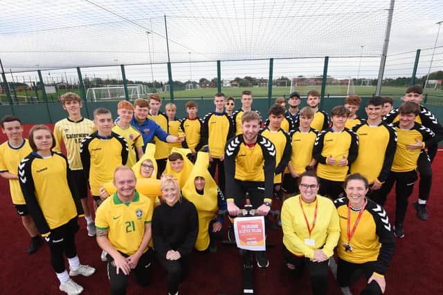 Staff and students from Fleetwood Town Community Sports College dress in yellow for a train-athon to raise money for Young Minds charity