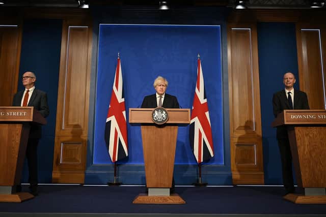 Chief Scientific Adviser Patrick Vallance, Prime Minister Boris Johnson and Chief Medical Officer for England Chris Whitty during a media briefing in Downing Street