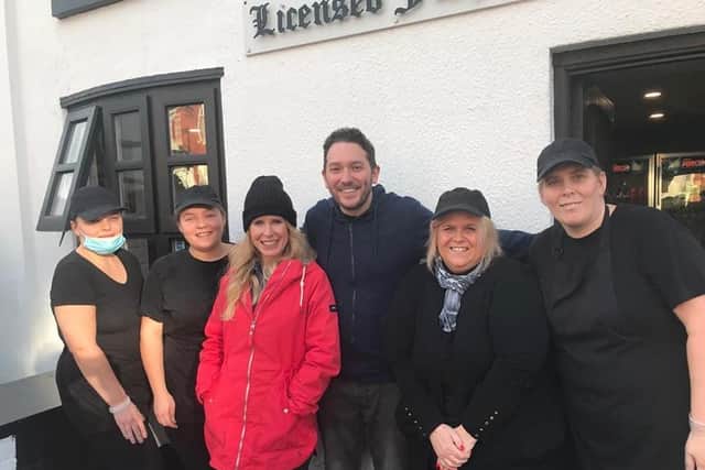 Comedy couple Jon Richardson and Lucy Beaumont (centre) with Cottage Chippy staff members Lisa Wright, Tina Taylor, Lauren Culshaw and Simone Carney, who said the stars were an "absolute pleasure to serve"