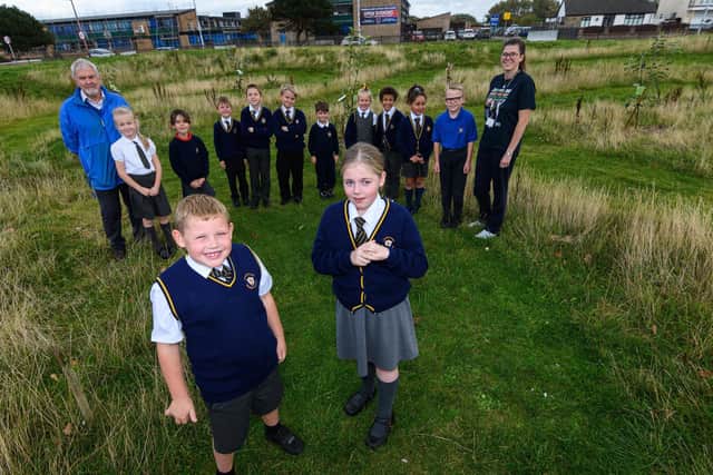 Pupils from Larkholme Primary School in Fleetwood in the orchard where they have planted trees and flowers. Photo: Kelvin Stuttard