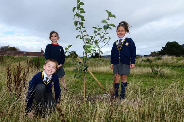 Larkholme youngsters with one of the fruit trees