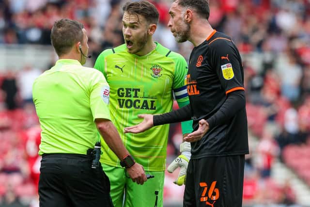 Richard Keogh (right) is an option to skipper Blackpool in the absence of Chris Maxwell (centre)