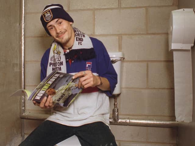 John Cassidy sits on one of the newest toilets at Preston North End