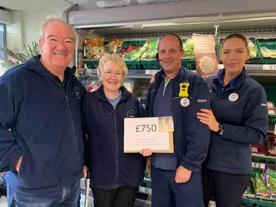 The campaigners at the Highfield Road store raised £750 for the new picnic bench