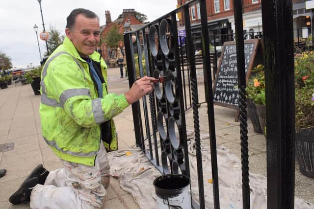 Contractor Gary Carr painting railings in Clifton Square, Lytham
