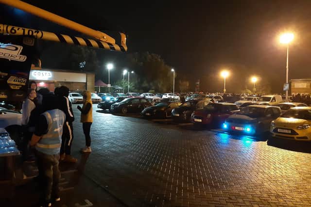 Cars gathered at Squire's Gate retail park on Sunday night