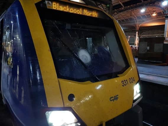 A damaged train after a stone was thrown at the windscreen in Leyland