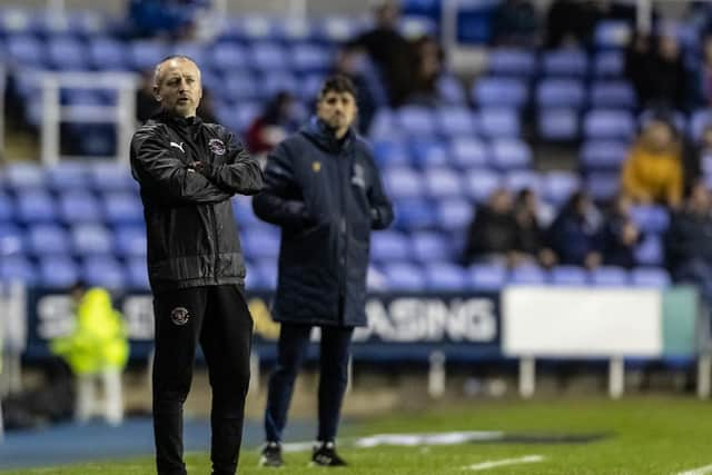 Veljko Paunović watches on behind Neil Critchley