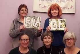 The Fylde Coast Amnesty Group, including chairman Norah Lynam (top left)