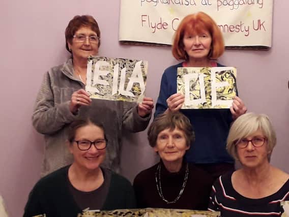 The Fylde Coast Amnesty Group, including chairman Norah Lynam (top left)