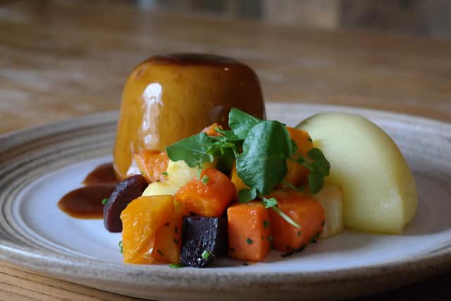 Chris says this is one of the most popular dishes: Braised oxtail & beef skirt in real ale suet pudding, with seasonal vegetables, creamed mash andred wine jus