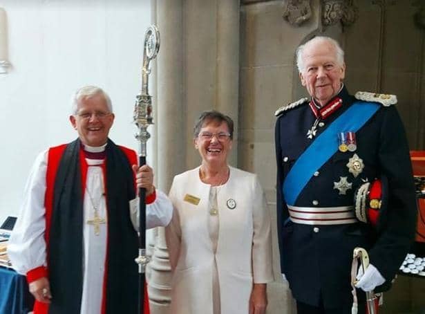 Enid Nutland with the Bishop of Blackburn, The Right Reverend Julian Henderson (left) and the Lord Lieutenant of Lancashire, Lord Shuttleworth