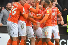 Blackpool's players celebrate a memorable derby victory