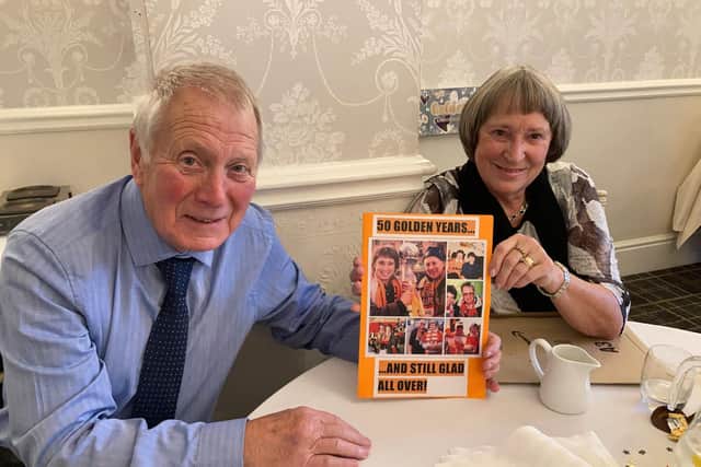 Russell and Pat Jones with their golden wedding card signed by Blackpool FC's players