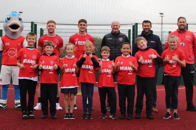 Fleetwood Town manager Simon Grayson, with players, staff and the club mascot, are spreading the Fleetwood Town message among local schools