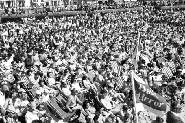 Thousands of visitors taking in the sun on the sands in Blackpool decades ago