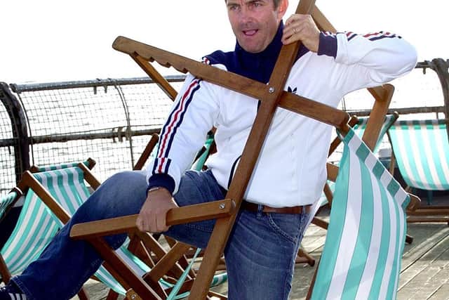 Deckchairs are synonymous with the seaside - and trying to put them up like Bradley Walsh was - seen here wrestling with a deckchair in 2005