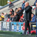 Simon Grayson watches his Fleetwood side against Wycombe on Saturday and faces another top side, Wigan, on Tuesday