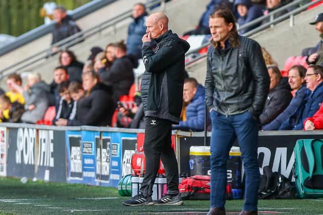 Simon Grayson watches his Fleetwood side against Wycombe on Saturday and faces another top side, Wigan, on Tuesday